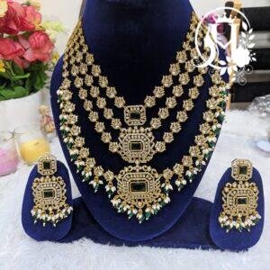 Gold-Plated Antique Cubic Zirconia (CZ) Kundan Step Necklace Set with Emerald & Pearl Drops